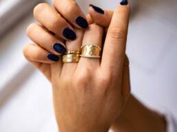 layered rings on hand